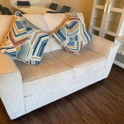 Loveseat (Ashley's furniture) with 4 year protection plan