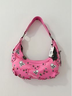 Ed Hardy hobo shoulder bag featuring tattoo-inspired skull and heart women’s prints with studded accents.
