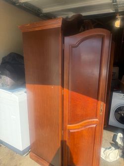 traditional-style wood armoire