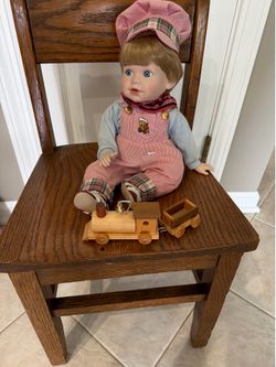 Jim y doll from Danbury mint. Chair not included. See description below