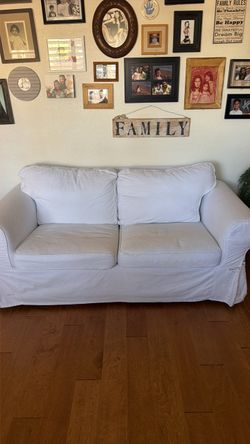 White Slipcovered Two-Seat Sofa