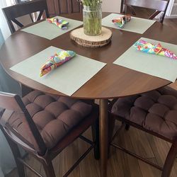 Counter size table with 4 solid wood chairs