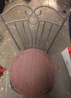 Four antique wrought iron and woven patio chair