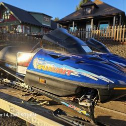 2 Snowmobiles & Trailer