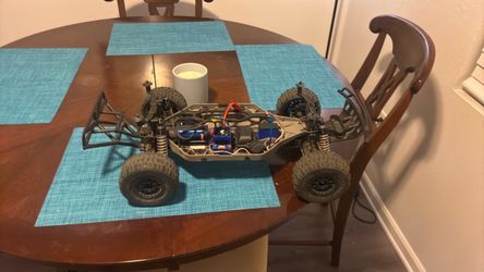 Traxxas slash 4X4 with lots of upgrades plus traxxas 4s charger and repair kit including lots of extra parts I have 800 dollars into all of it ..