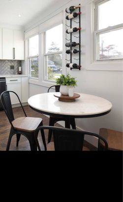 White marble table -with black metal pedestal - 4 chairs metal and wood