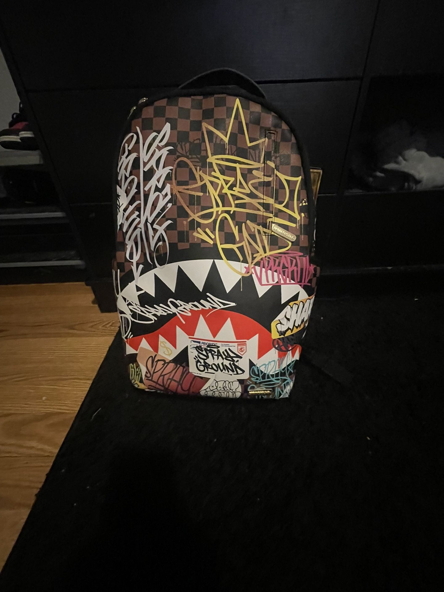 Spray ground backpack