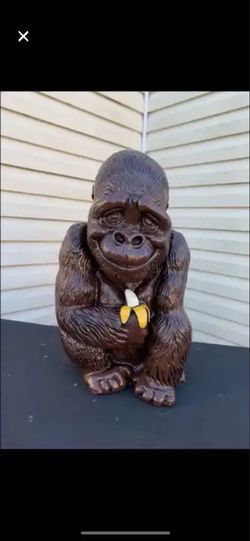 Gorilla holding banana statue