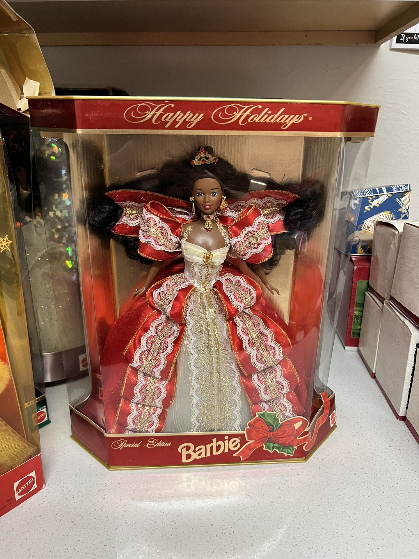 1997 Happy Holidays Special Edition African American Barbie. This doll was released by Mattel to celebrate the 10th anniversary of the Happy Holidays