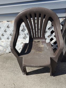 2 plastic chairs and a whole bunch of plastic lawn and garden edging