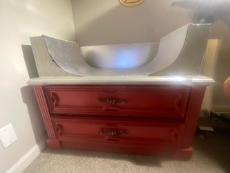 medium dresser with wood built halfpipe on top