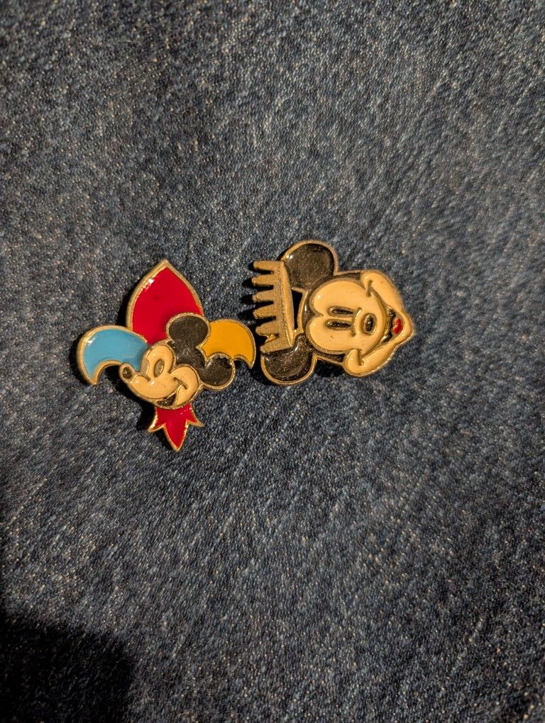 two vintage enamel metal button covers featuring Mickey Mouse. 