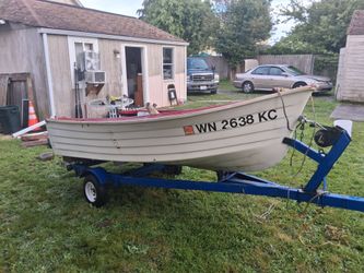 10 ft. Fiberglass boat with trailer.  Selling 'as is'.