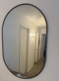 Oval Black Metal Framed Mirror