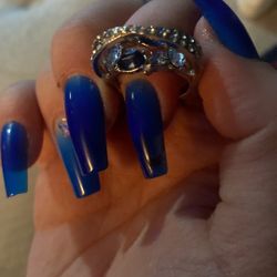 It’s silver with blue and it is a size 6