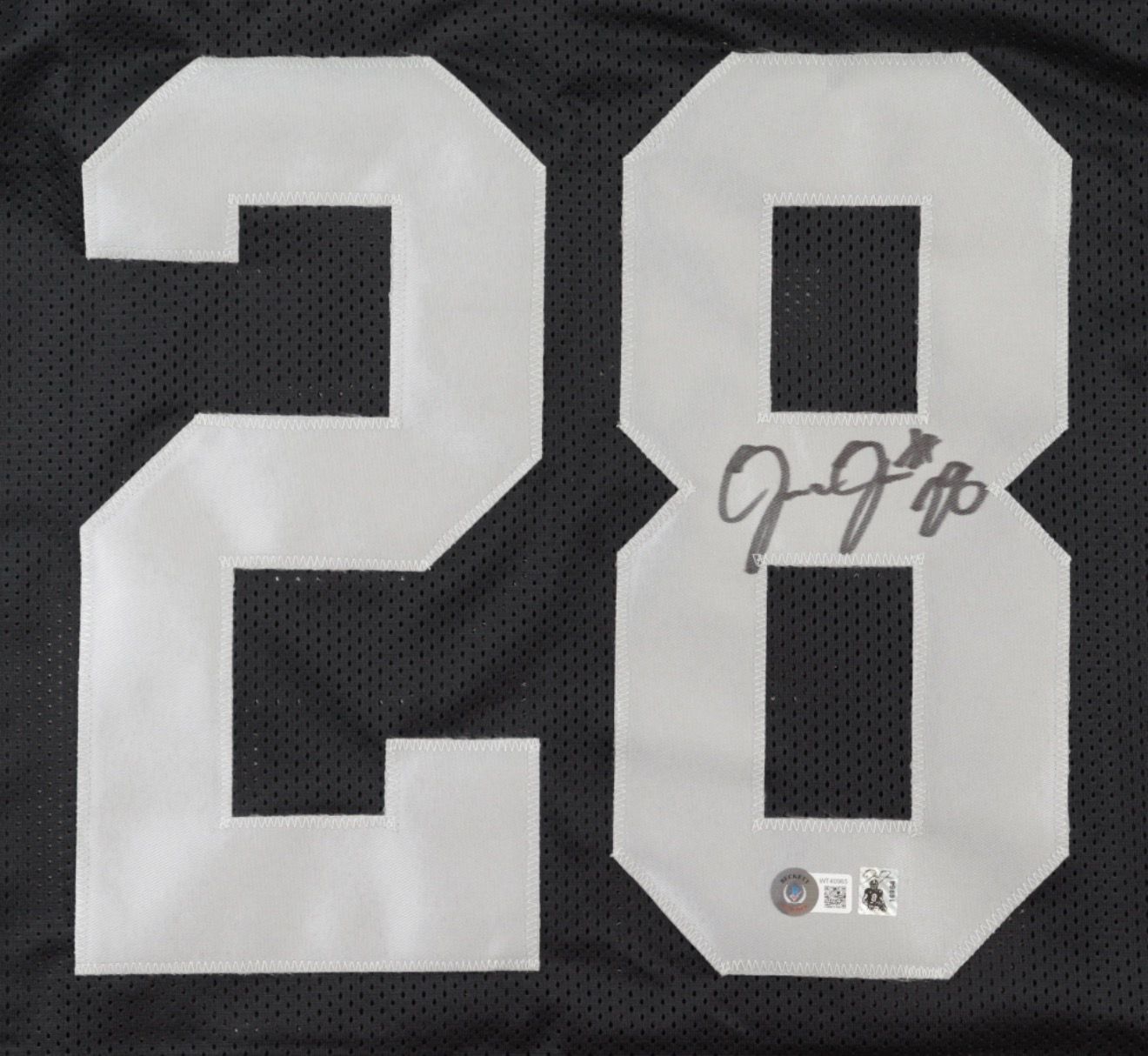 New Josh Jacobs autographed Raider jersey.