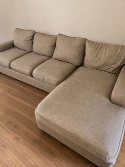 Beige L shaped couch can deliver