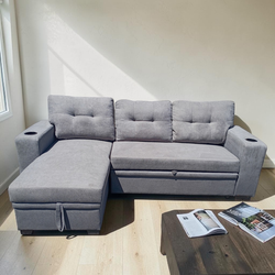 Small light grey sectional with pullout  bed