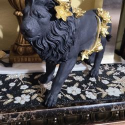 New decorative lion statue — 20 inches long by 14 inches high.