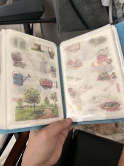 Postcard album with a bunch of Stickers inside