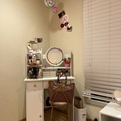 Vanity with mirror and lights + pink bow chair