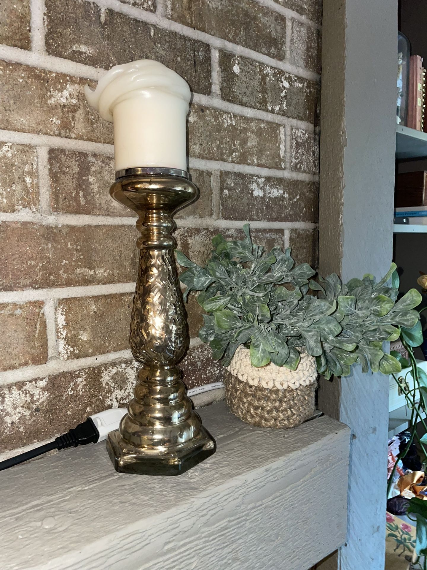 Gold Candlestick And Fake Plant