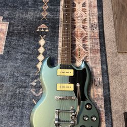 Epiphone SG Special P-90 electric guitar in Faded Pelham Blue, featuring a Bigsby vibrato tailpiece