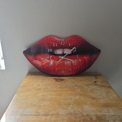 Women's red lips. Shaped wall clock.