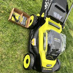 LAWN MOWER RYOBI  20” SELF PROPELLED  40 VOLTS  BRUSHLESS   LITHIUM BATTERY  LEVEL POSITIONS  ((((CHARGER AND BATTERY INCLUDED)))