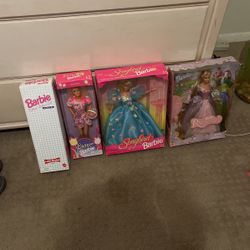 Four Unopened Barbie Dolls In Box