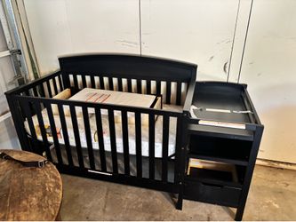 New crib never used mattress wrapped in plastic turns into toddler bed with changing table attached