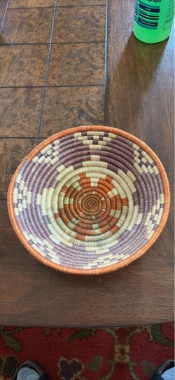 Decorative hand-woven basket