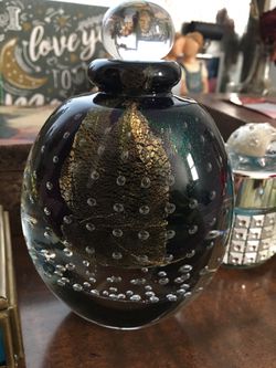 Hand blown glass perfume bottle signed on bottom very pretty and heavy .