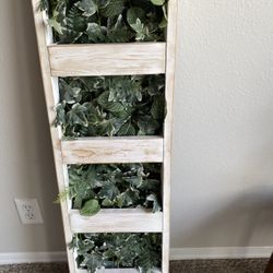 Decorative rustic wooden with lush green foliage. Perfect for adding a natural touch to any space.