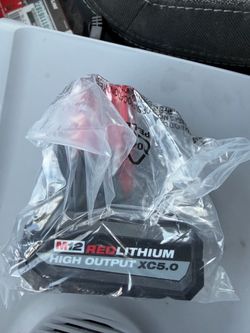 M12 5ah high output battery and charger both new.