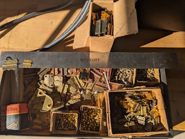 Hundreds Of Small Brass Hinges And Screws