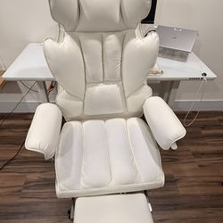 White ergonomic office chair with footrest
