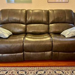 Ashley Furniture's gray leather power reclining sofa and loveseat