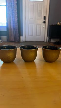 3 small cast iron teacups