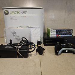 Xbox 360e with box and 4 games