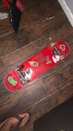 Red Complete Skateboard with Stickers