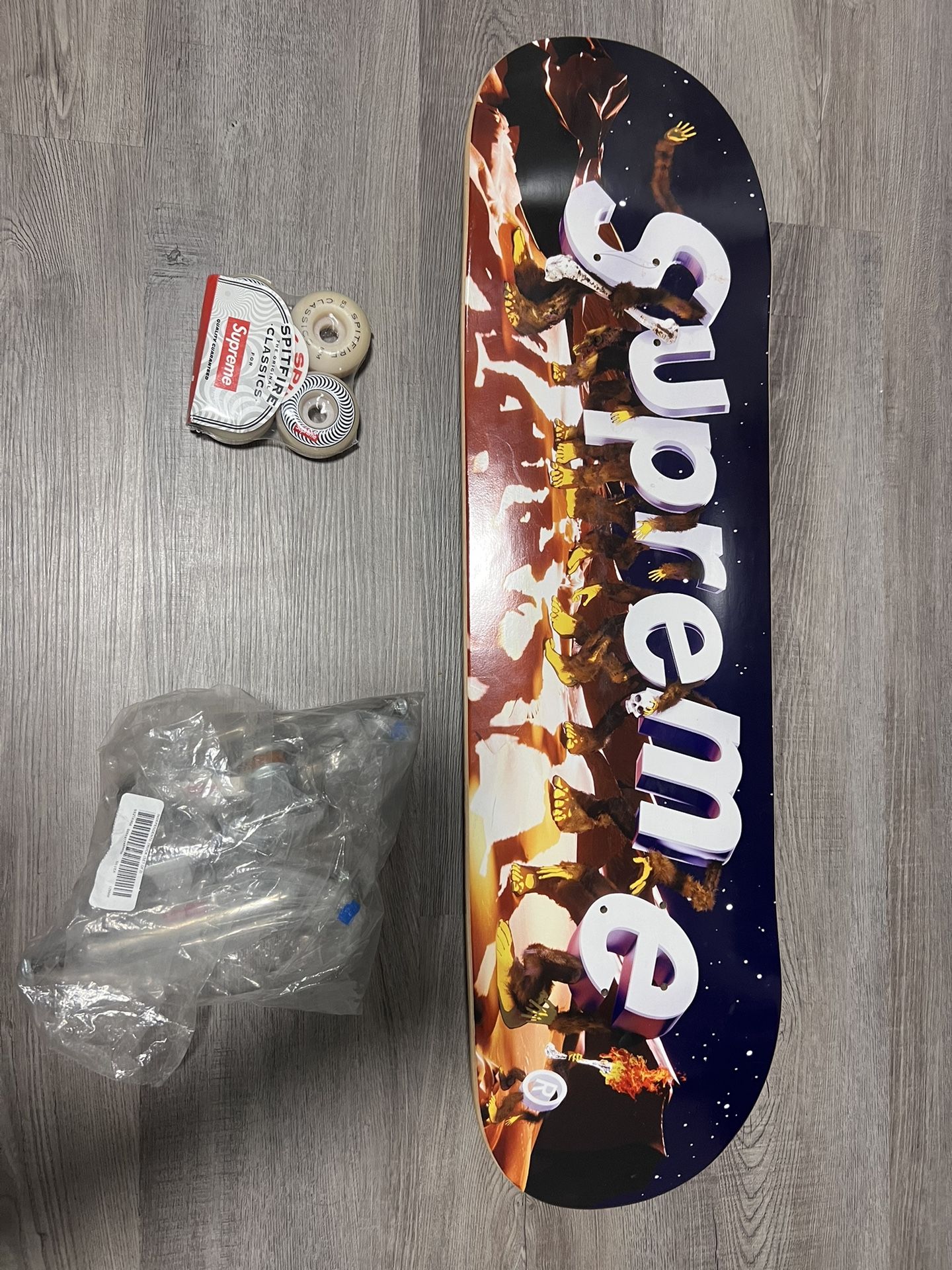 Supreme Skateboard unopened never used. Comes with trunks and wheels brand new!