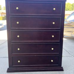 dark Cherrywood, five drawer dresser with gold knobs
