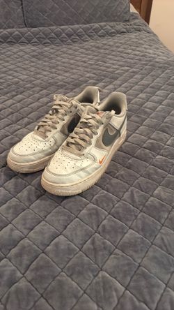 White, Grey, and Orange Nike Shoes