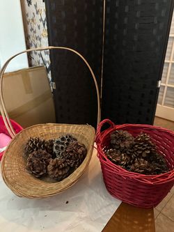 2 fall decor baskets with pinecones