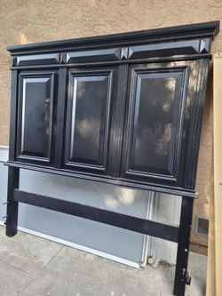 Black Queen size head and footboard with box spring .
