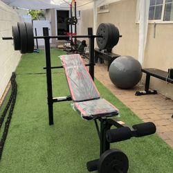 Gym Equipmentt bench press with 100lb weight set Combo With leg extension