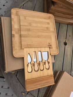 Bamboo cutting board with utensils