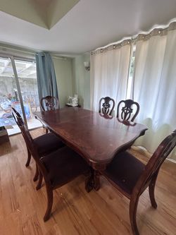 Wooden dinning table with 6 chairs