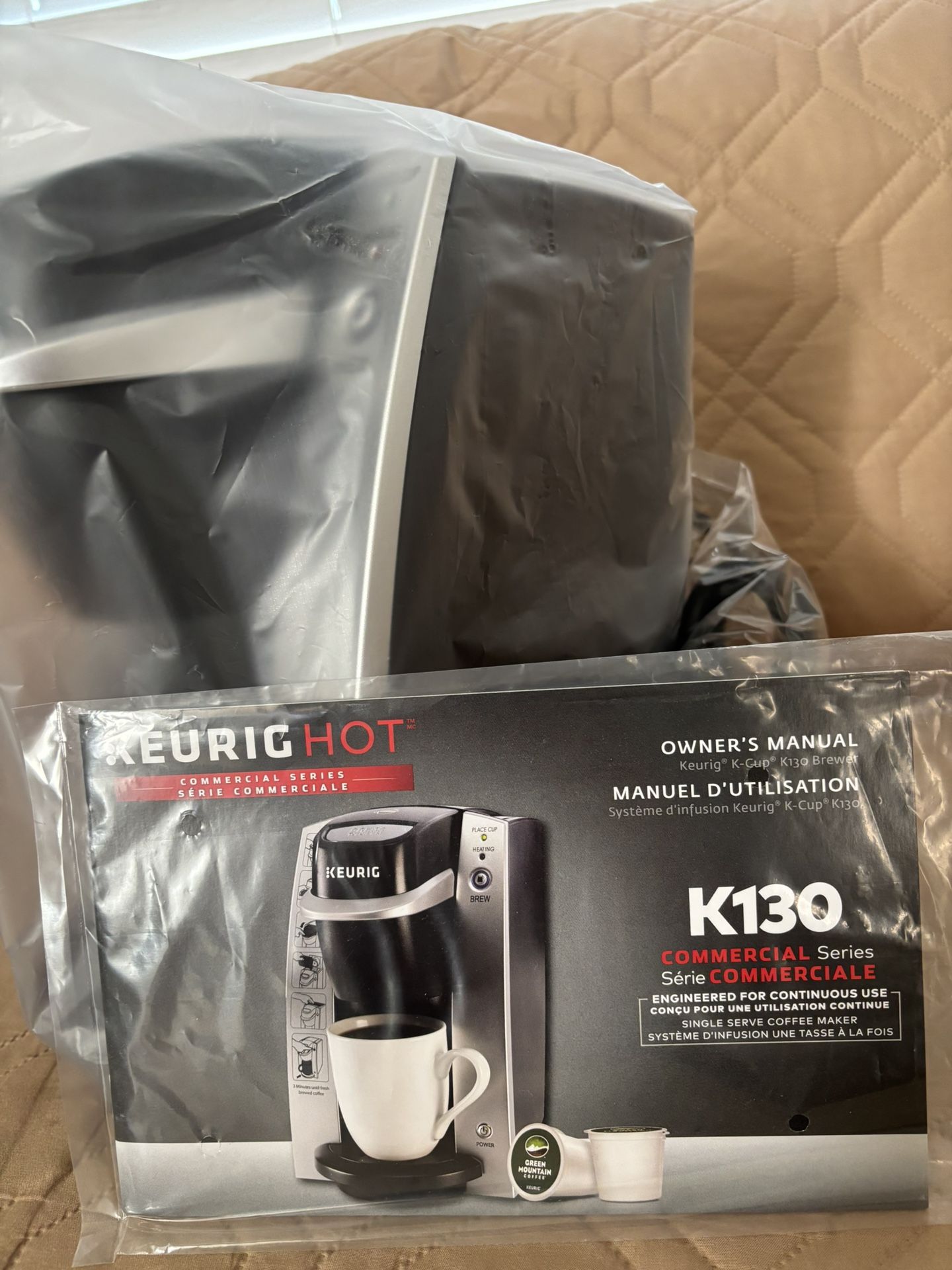 Brand New: Keurig Black and Silver Coffee Brewer K130 In Room Brewing System. Compact Keurig brewer. Sleek black and silver design.